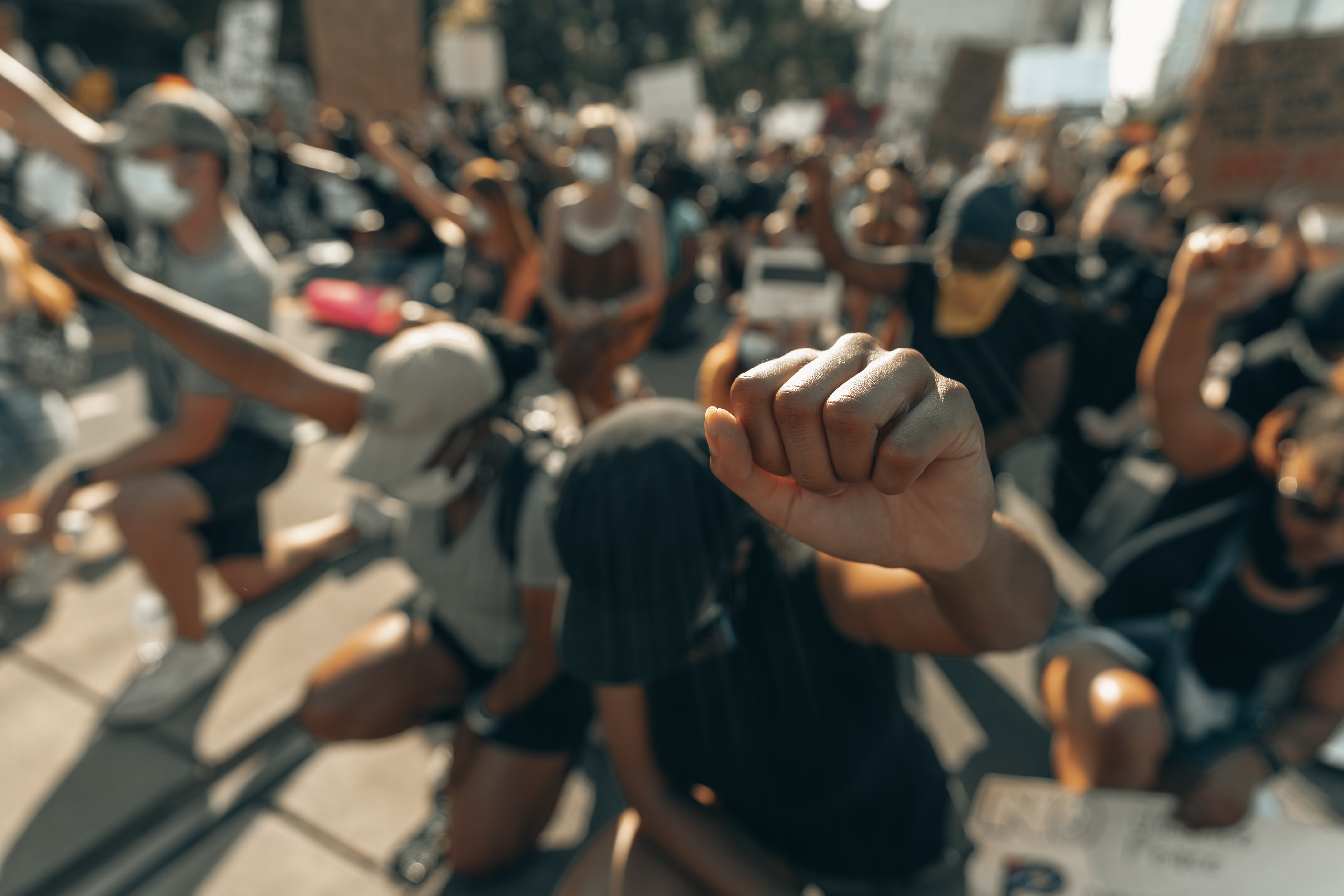 A fist raised in solidarity for George Floyd; photographed by Clay Banks A fist raised in solidarity for George Floyd; photographed by Clay Banks